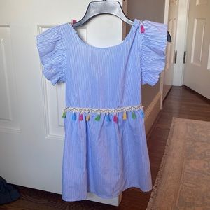 Striped top with tassels. Super cute!   Tie in the back